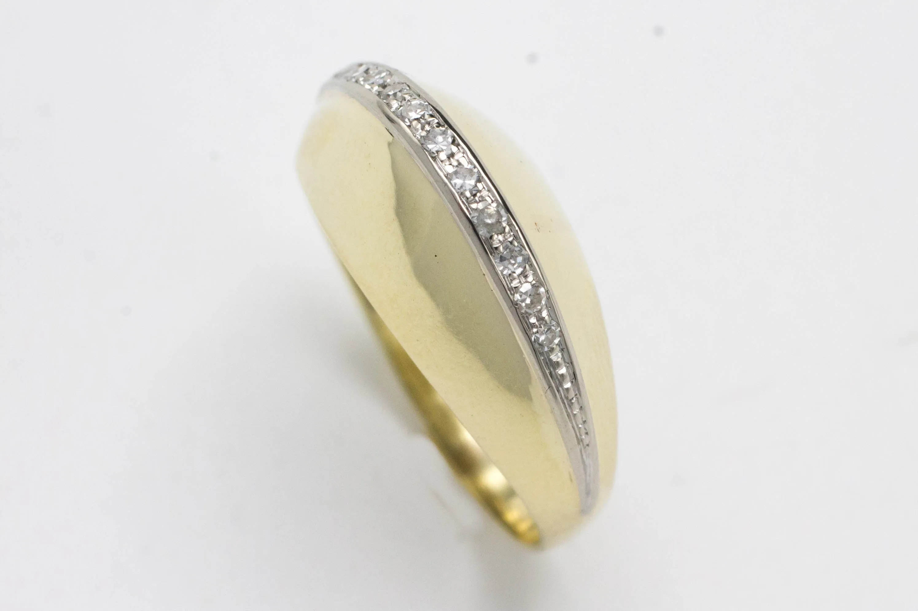 Arch style ring with half cut diamonds in 14 carat gold