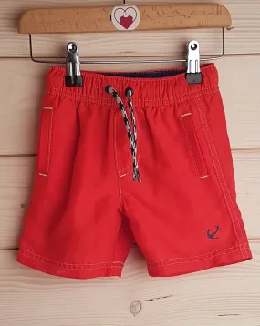 Red swim shorts (12-18 months)