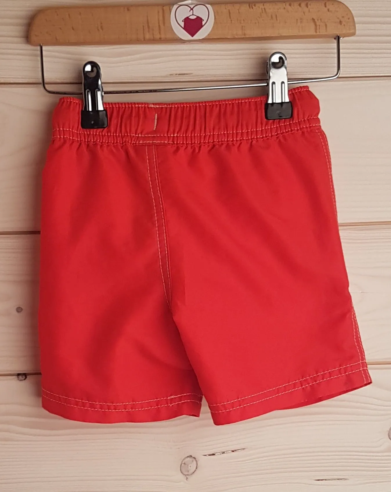 Red swim shorts (12-18 months)